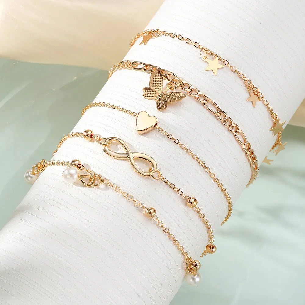 Alloy butterfly pearl heart anklet 4-piece set multi-layer women's simple style foot chain
