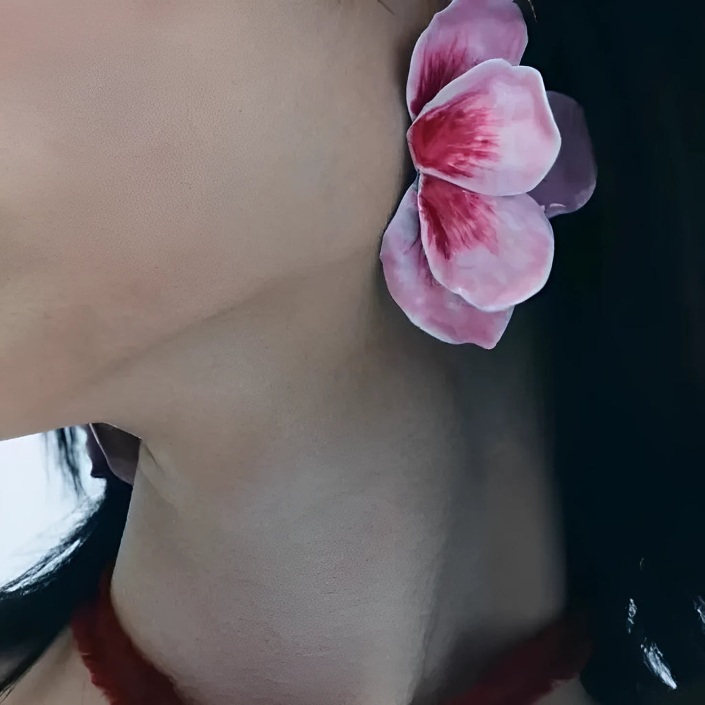 A pair of pastoral style alloy stud earrings with oil-spot glaze floral design in one of four colours.