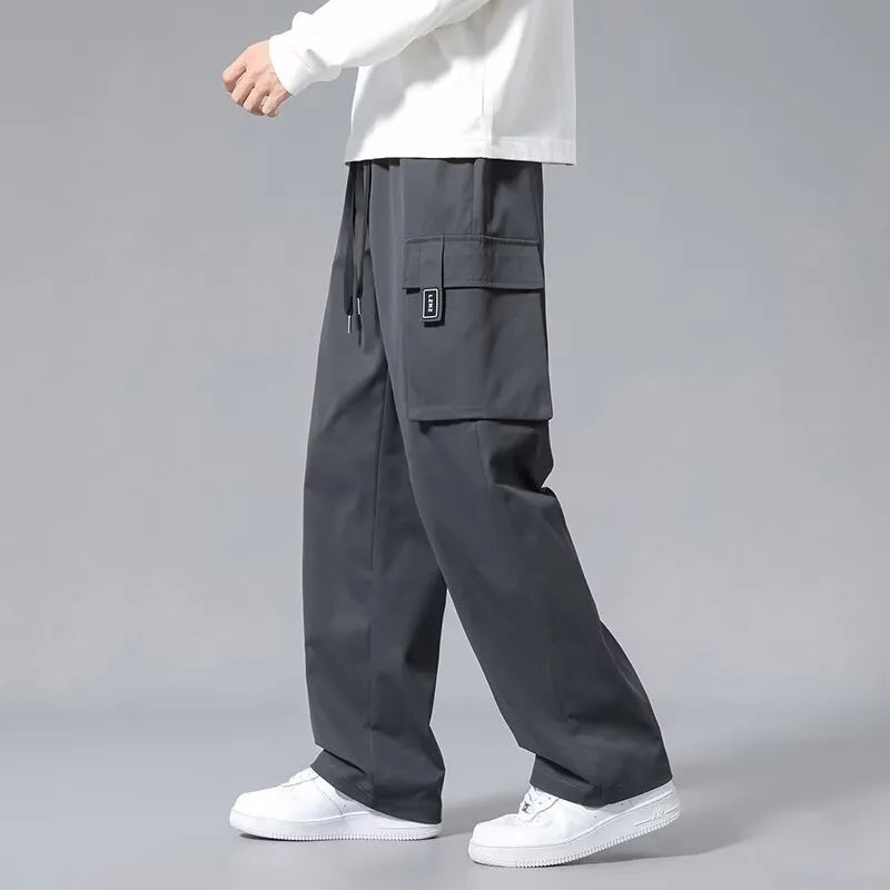Boys' straight leg cargo trousers with drawstring waist and large pockets in polyester fabric