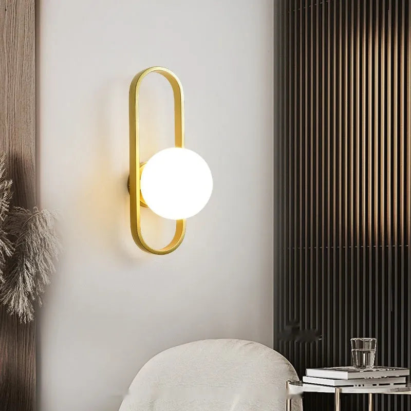 Minimalist wall-mounted lamp with glass shade and iron body in black finish