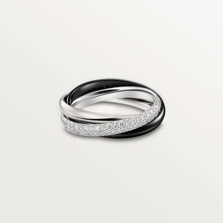 Geometric U-shaped silver couple ring with a full diamond band on a black background.