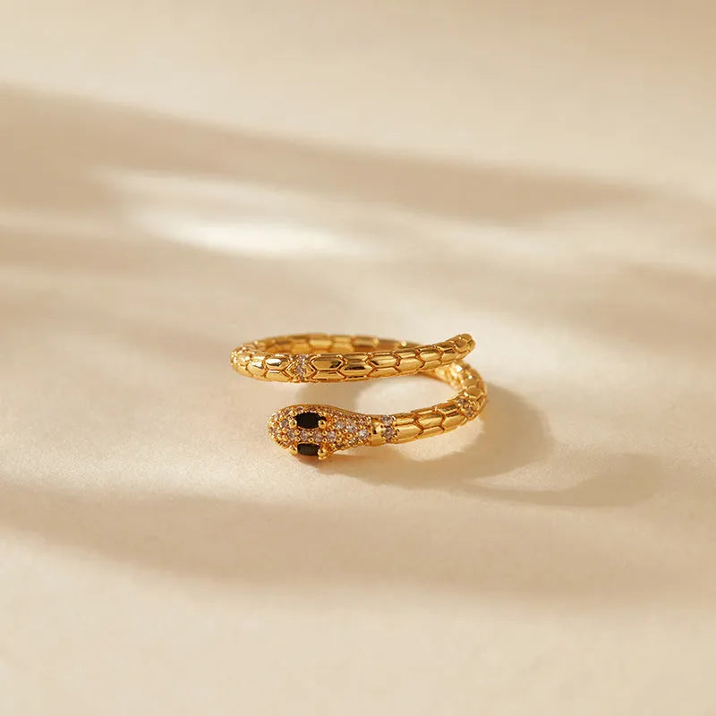 Adjustable snake-shaped copper index finger ring with 18K gold colour and diamond treatment
