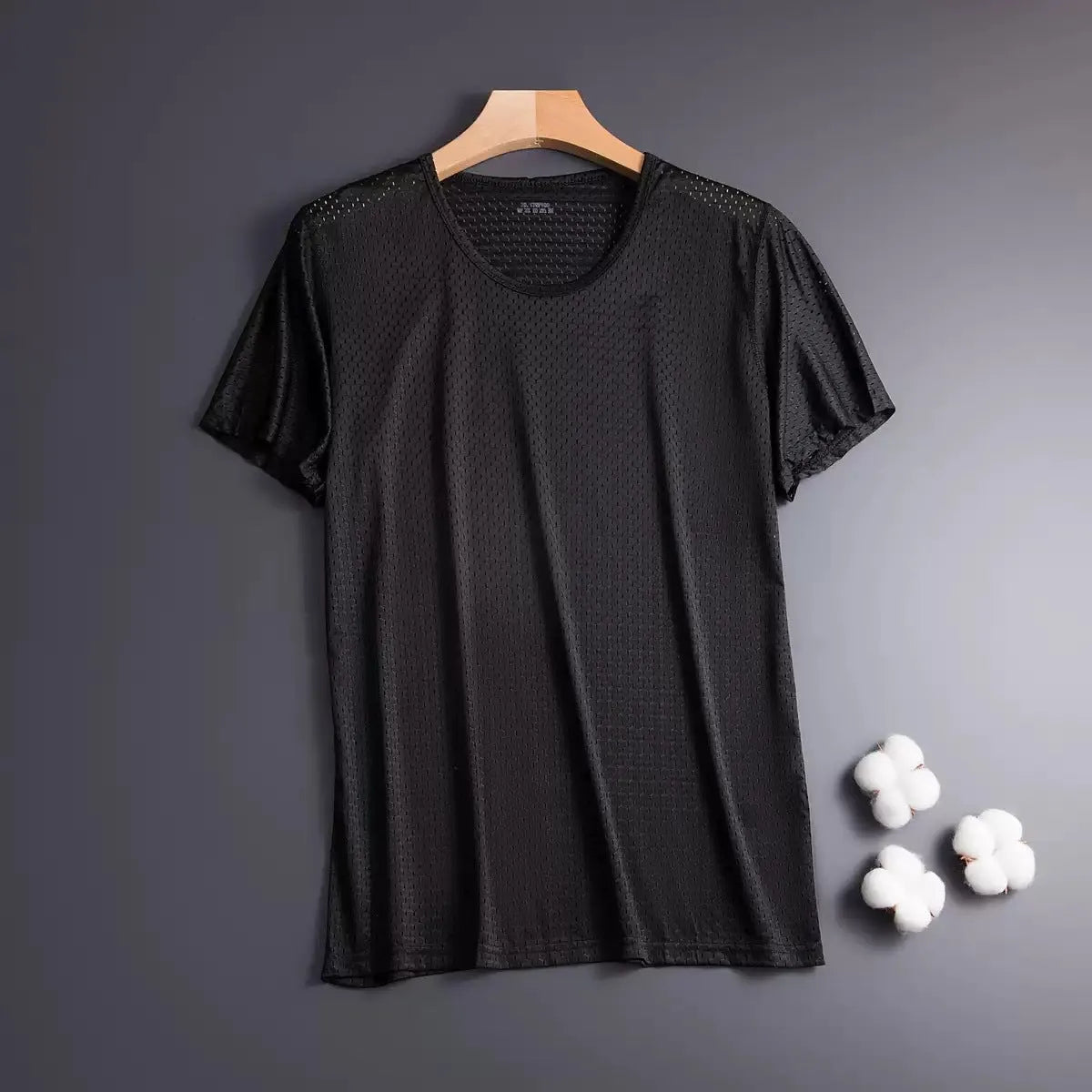 Man wearing a thin grey Ice Silk short sleeve crew neck t-shirt with a loose fit.