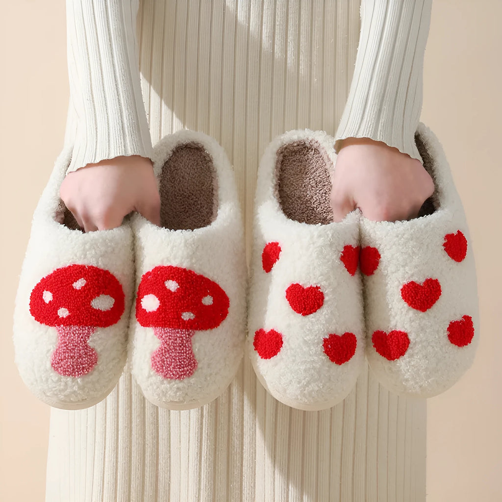 Women's plush cartoon love style home slippers with a non-slip PVC sole.