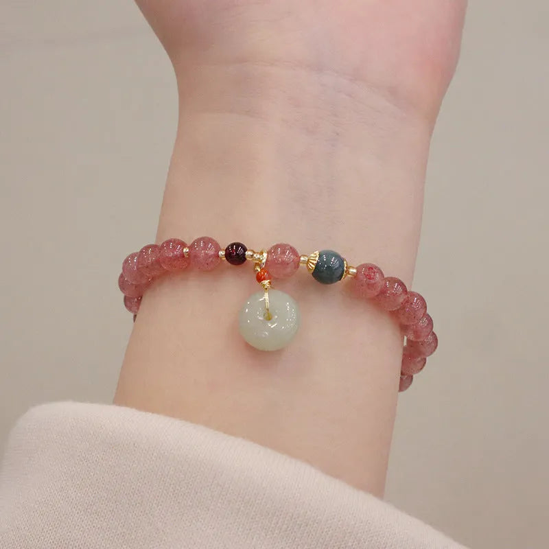 Geometric Strawberry Quartz women's bracelet with a lucky Bagg charm and a silver safety buckle clasp.