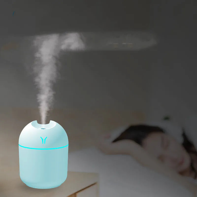 Round desktop humidifier in ivory white colour with USB cable and 250ml capacity marking