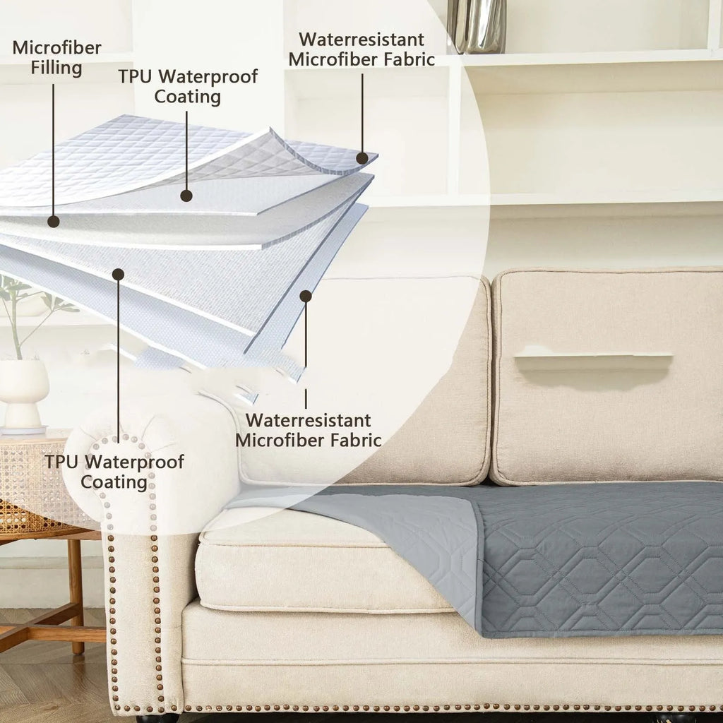 Reversible dark grey and light grey waterproof dog sofa cushion on a leather sofa