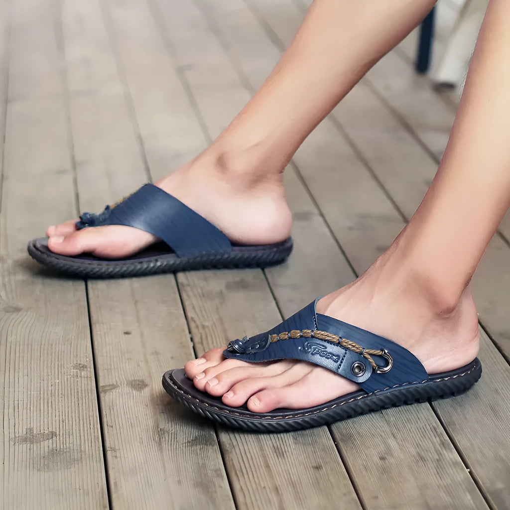 Men's black casual slippers with a non-slip sole and PU leather upper, shown from the side.