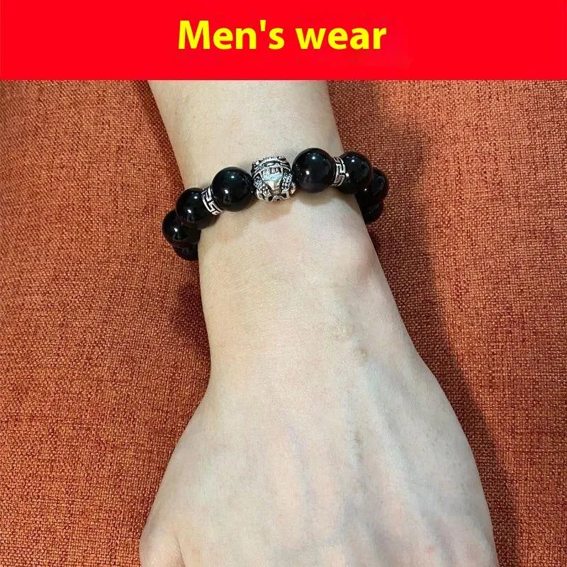 Natural obsidian stone bead bracelet with a silver clasp, shown in male 12mm and female 10mm size options.