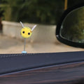 Swing spring bee car decoration made from soft fur ball, showing cartoon bee shape.