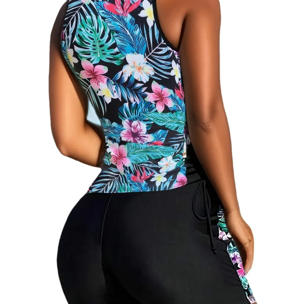 Plus size women wearing a floral printed high-waisted bikini in navy blue