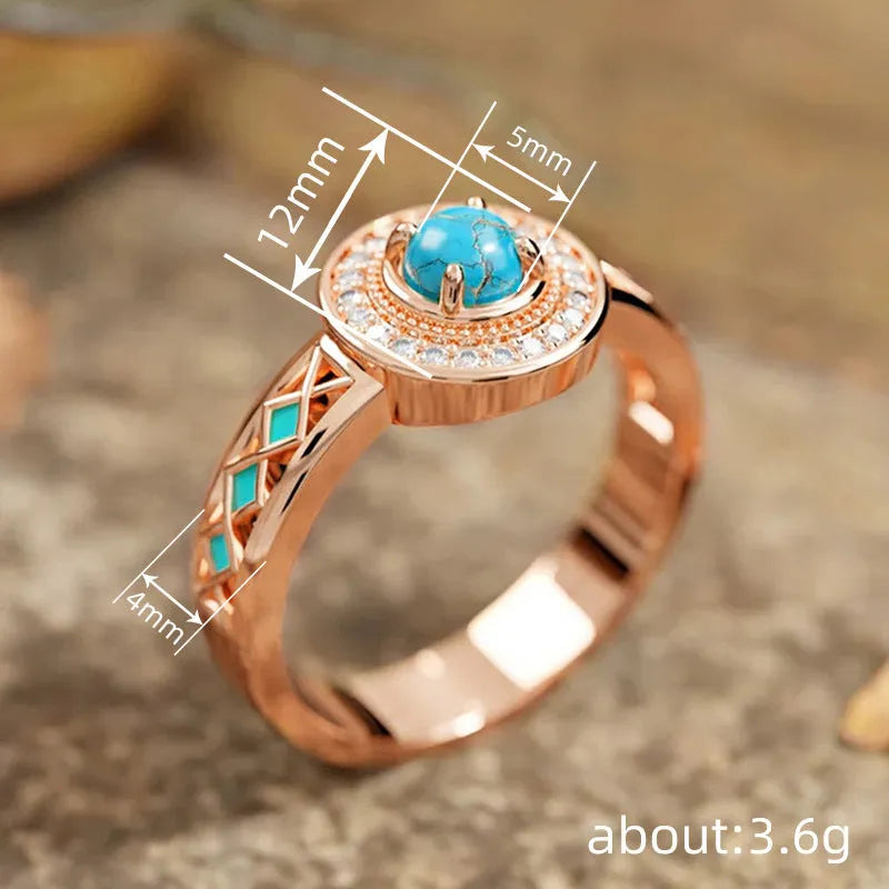 Women's rose gold coloured copper ring with geometric shape and inlaid turquoise zircon stones.