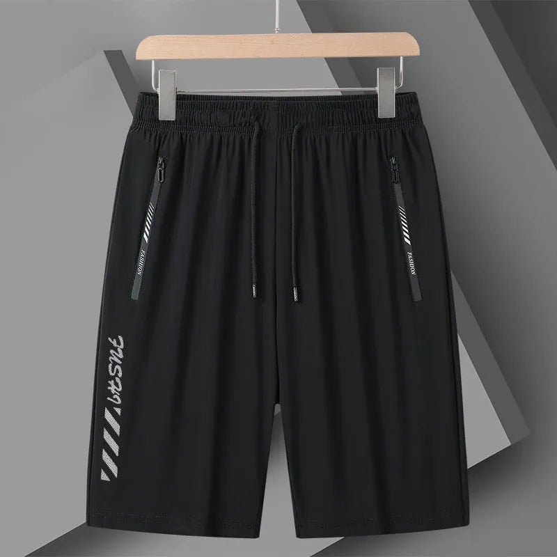 Men's black quick-dry nylon sports shorts with loose fit and fifth pants length on hanger