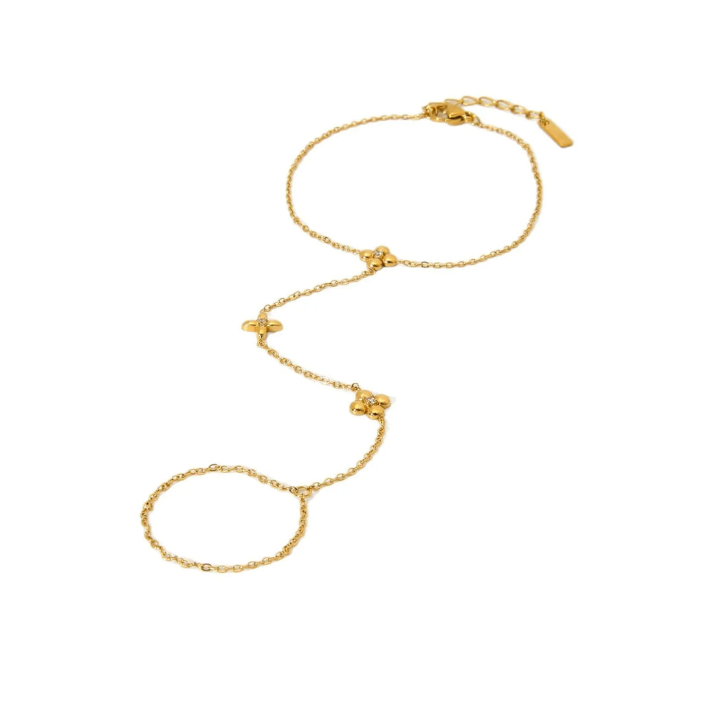 Gold women's stainless steel bracelet with an eight-pointed star and floral geometric design.