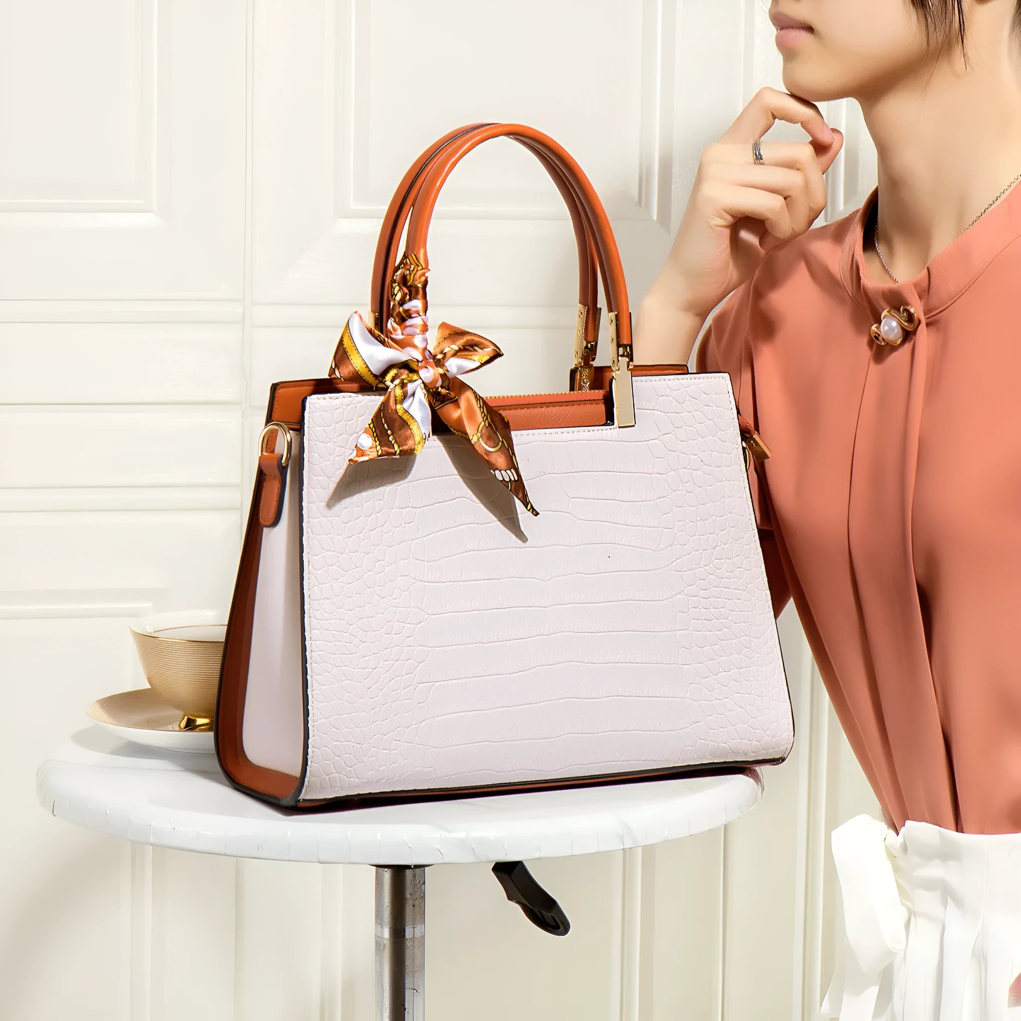 Milky white women's shoulder handbag with internal organisers and urban style sewing detailing
