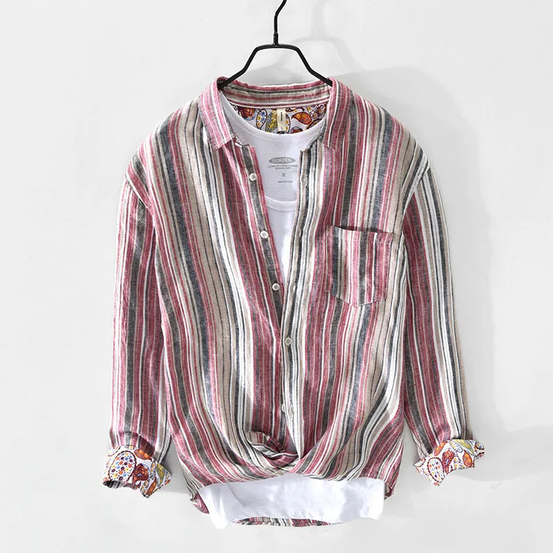 A man's casual red and grey striped linen shirt with long sleeves, laid flat to show its loose fit.