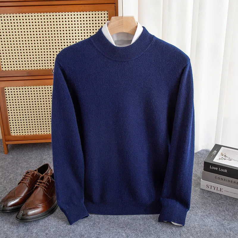 Man wearing a half-collar loose wool sweater in a textured rough yarn knit.