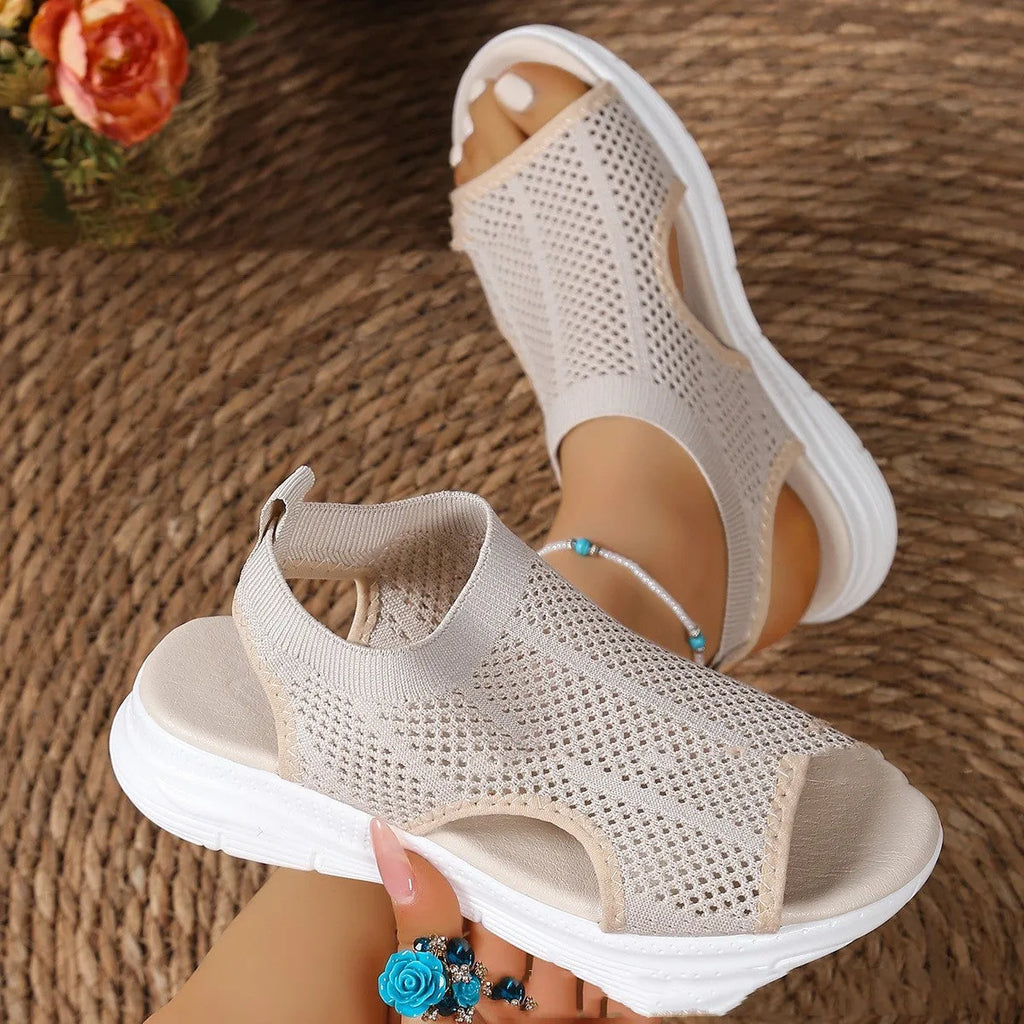 Women's black platform sports sandals with a flat toe and mesh lining on a rubber sole.