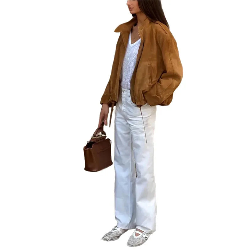 Man wearing a solid colour loose-fit retro style long sleeve polyester jacket.