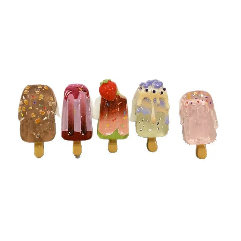 Resin ice cream design hair barrette with side clip fastening.