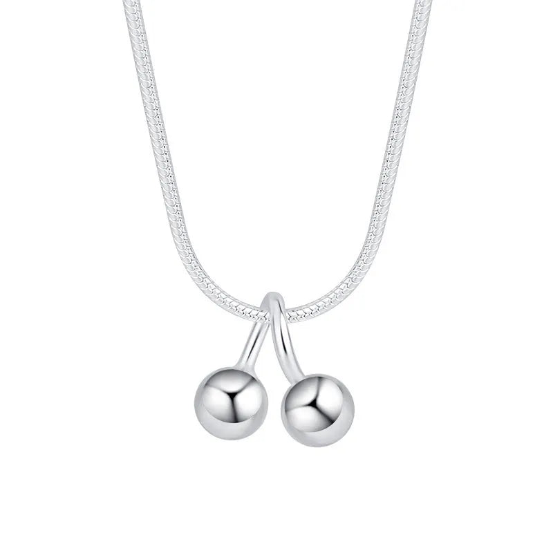 Silver cherry necklace for women with adjustable snake bone chain and Korean-style fruit pendant.