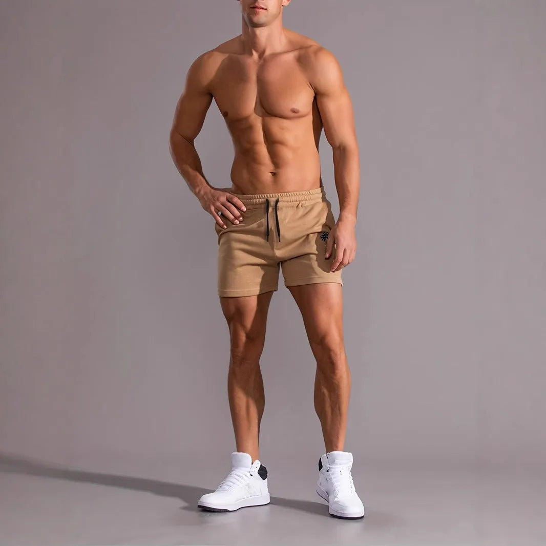 Men's khaki coconut printed sports shorts with straight leg design and micro elastic fabric