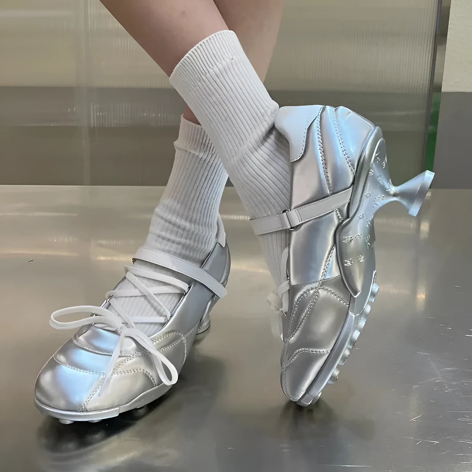Women's silver lace-up bow sports shoes with a low-top and round toe on a white background.