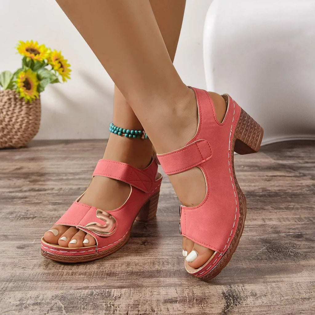 Light brown Velcro-strap Roman sandals with round toe and rubber sole on a white background.