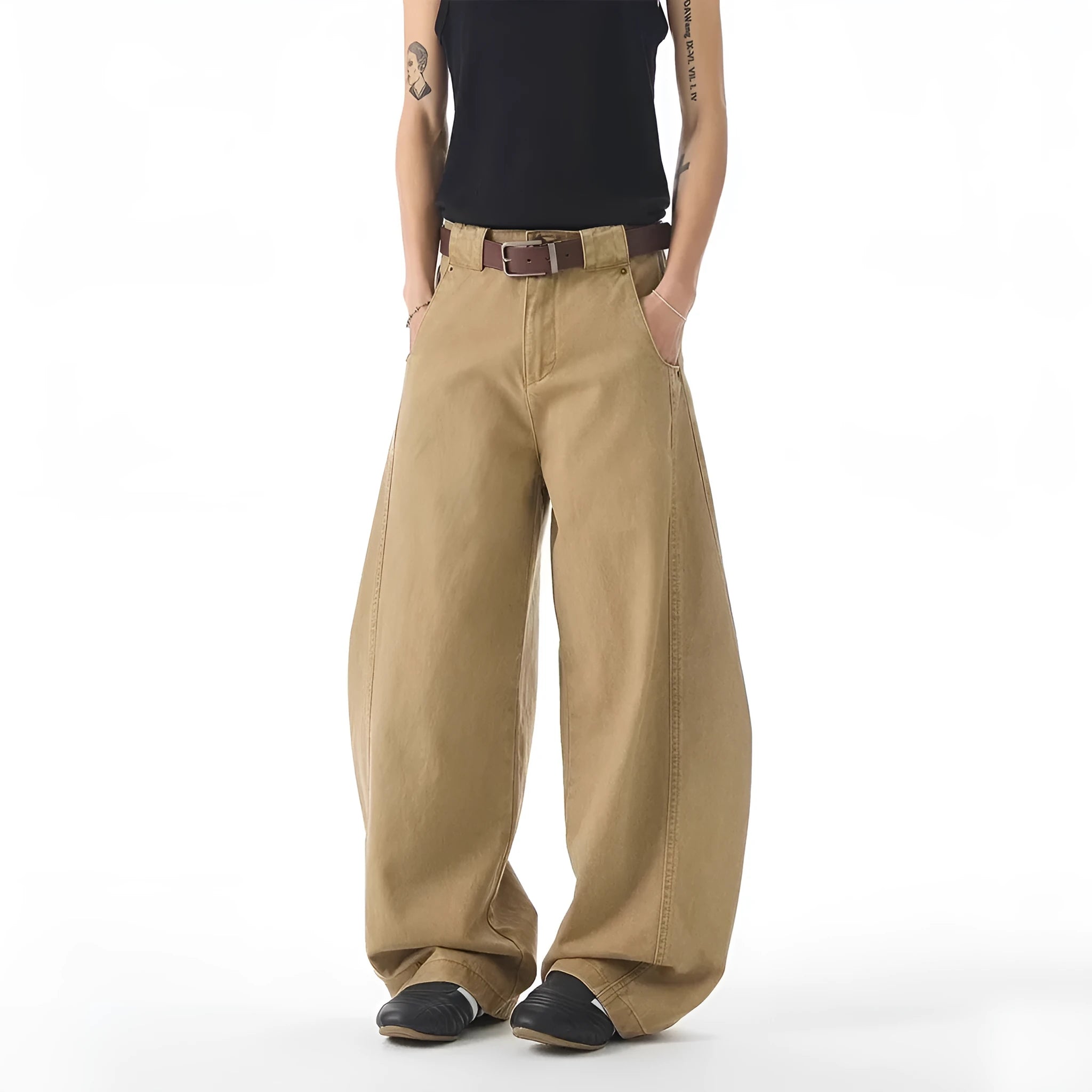 Brown men's loose fit straight leg jeans with a button fly on a mannequin.