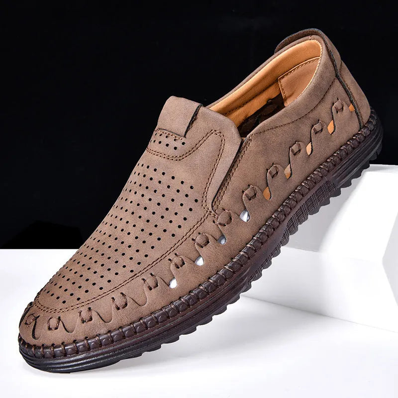 Men's brown casual slip-on shoes with round toe, flat heel, and sewn sole detailing.
