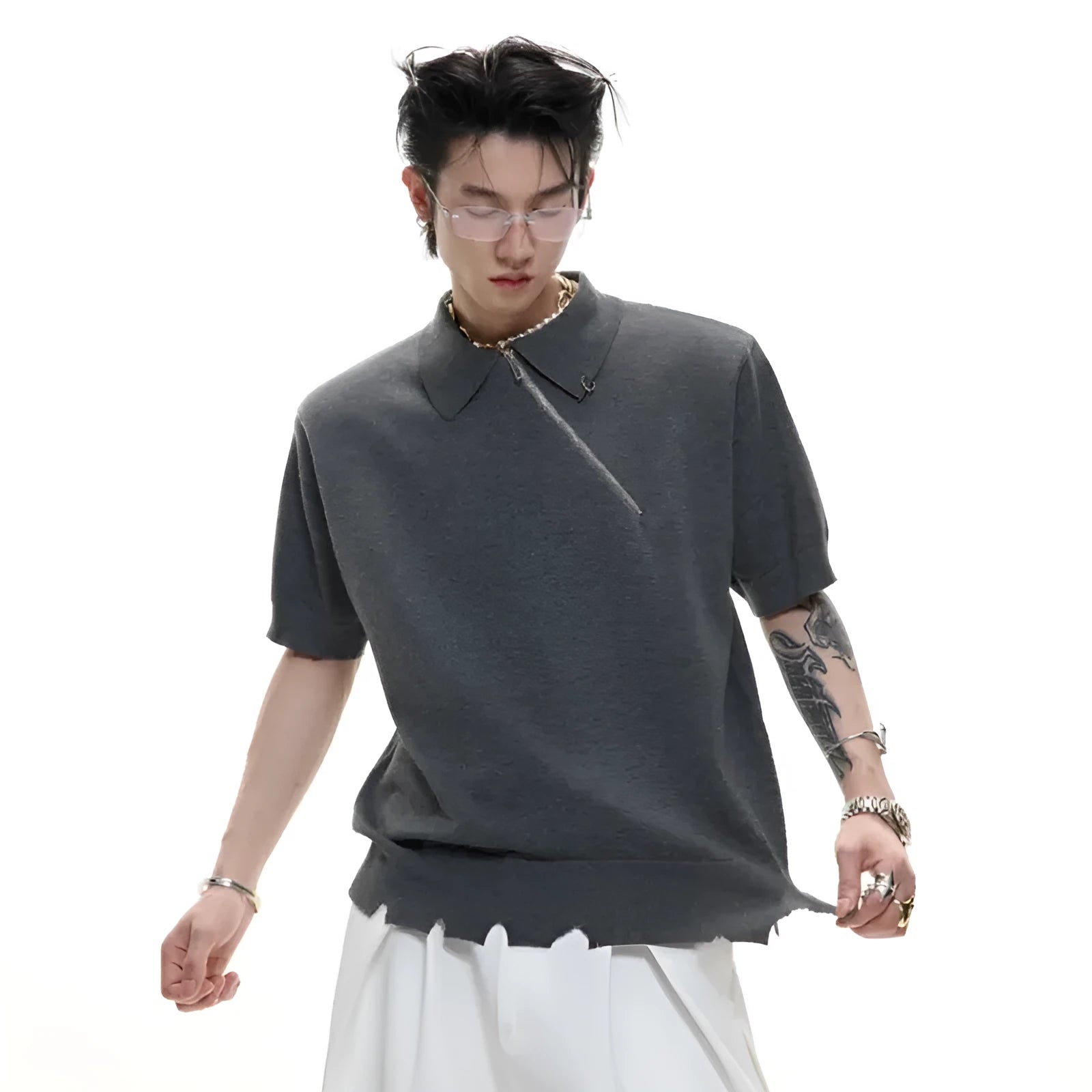 Men's slim-fit black knitted polo shirt with an oblique diagonal zipper and lapel collar.