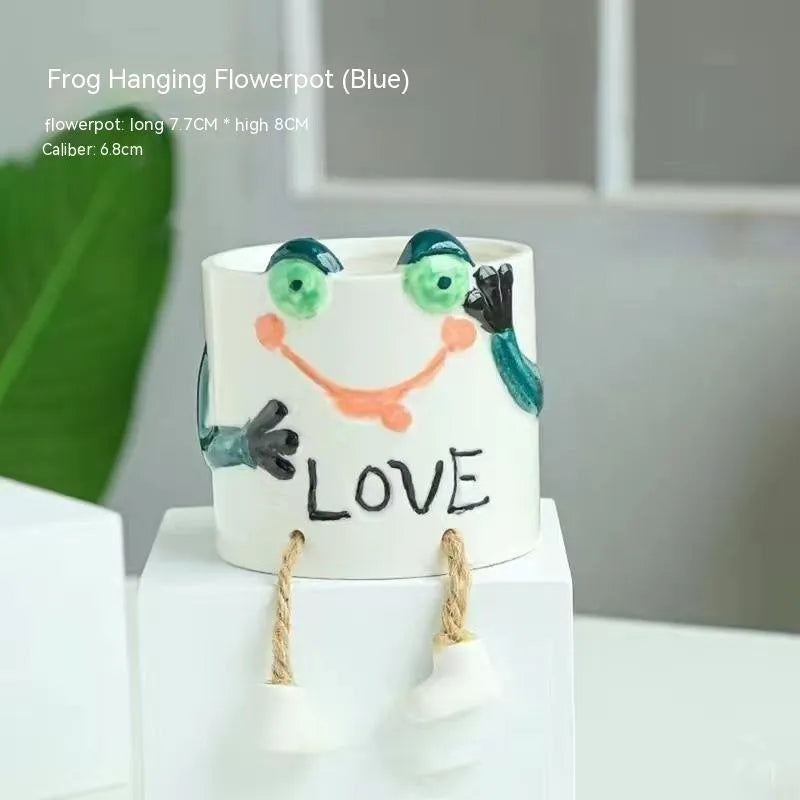 Ceramic hanging foot flowerpot in a cartoon style for desktop succulents.