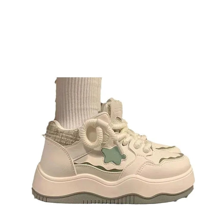 Women's green and pink patent leather platform sneakers with round toe and lace-up closure
