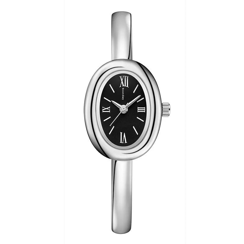 Women's slim oval retro quartz watch in gold colour on wrist