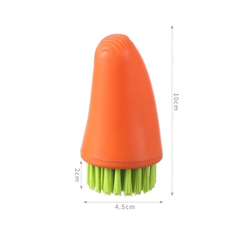 Orange and white carrot-shaped kitchen brush with nylon bristles for scrubbing.