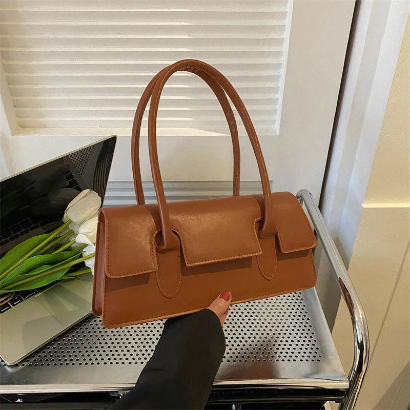 Women's black PU leather small square shoulder bag with stitching details and document compartment