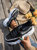 Women's Flyknit Mesh sneakers in a neutral colour showing lace-up design and rubber sole.