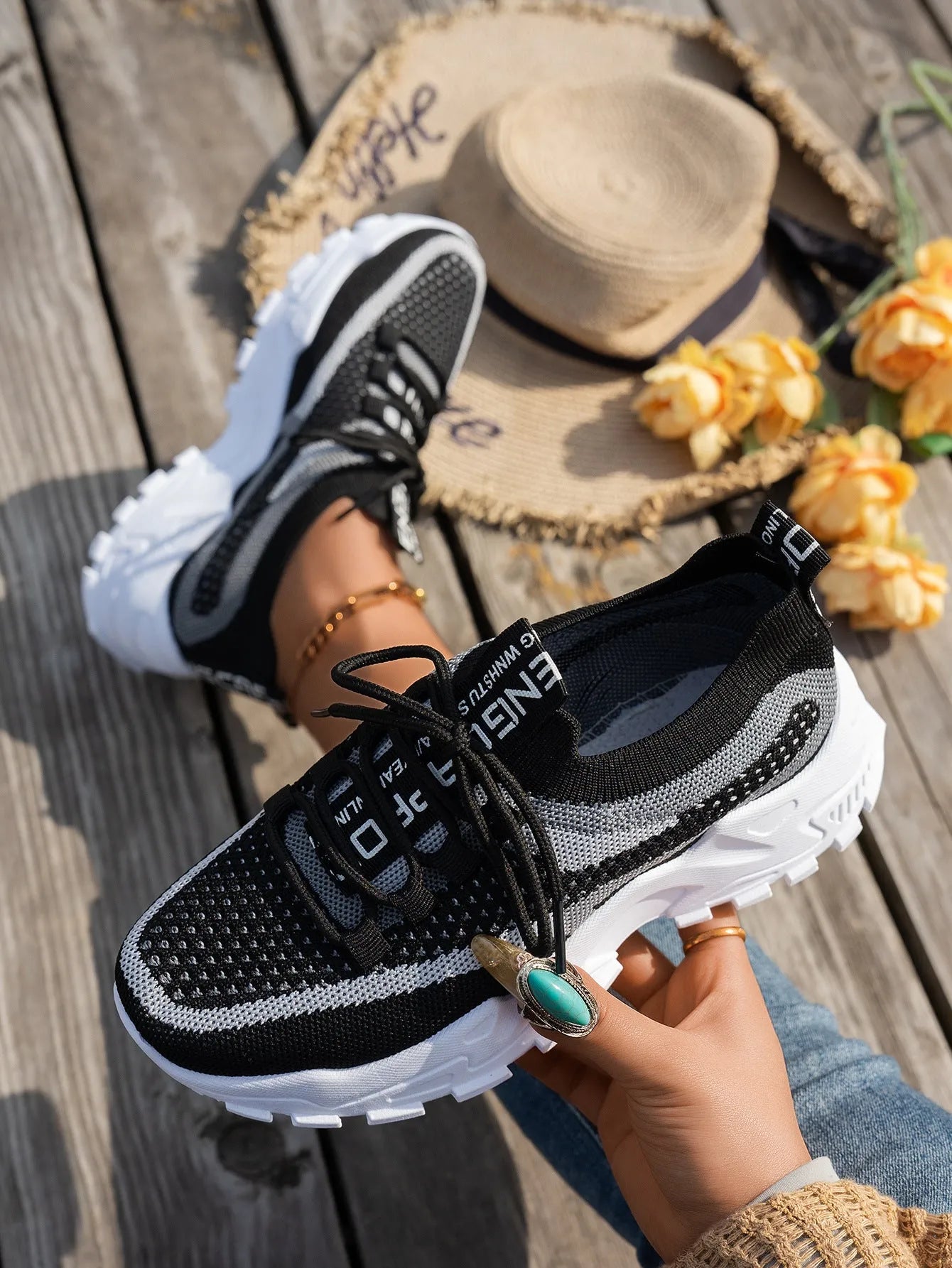 Women's Flyknit Mesh sneakers in a neutral colour showing lace-up design and rubber sole.