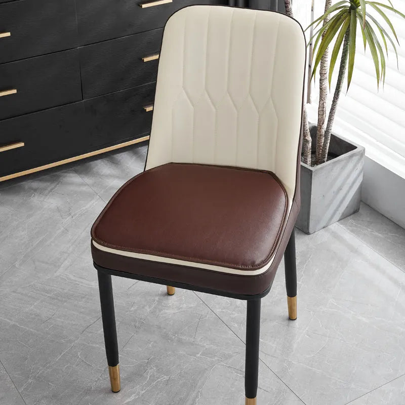 Leather horseshoe-shaped seat cushion in beige colour showing thickness and non-slip design