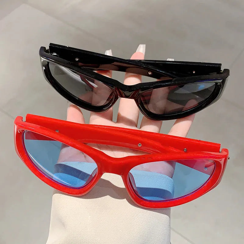 A pair of outdoor sports sunglasses with a PC frame and lens, shown in a black frame with grey lens colour variant.
