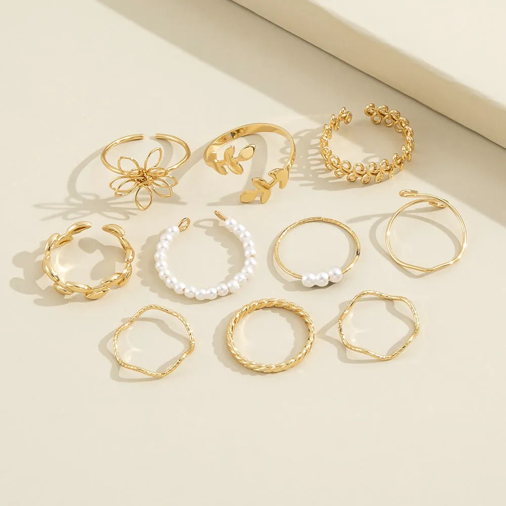 Women's openwork flower ring in electroplated alloy with gold J0656 colour and glossy finish