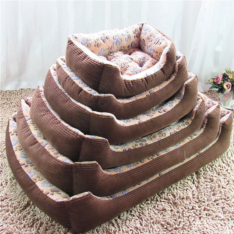 Camel coloured plush dog bed with sofa-style bolsters for small dogs, shown in Large 70x55cm size