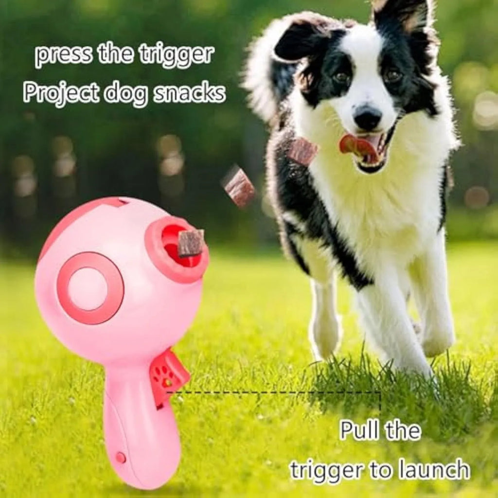 Green, orange, and pink dog treat launcher toy for interactive feeding and training