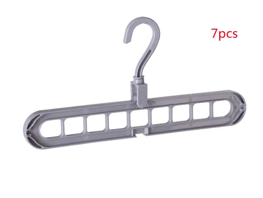 Plastic clothes hanger with rotating hook in pink colour, showing 33cm length dimension
