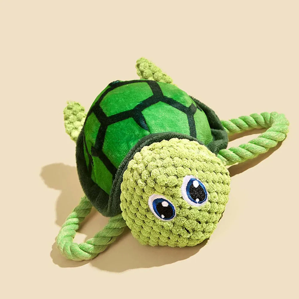 Turtle shaped dog chewing toy with knotted rope centre in grey green or orange colours