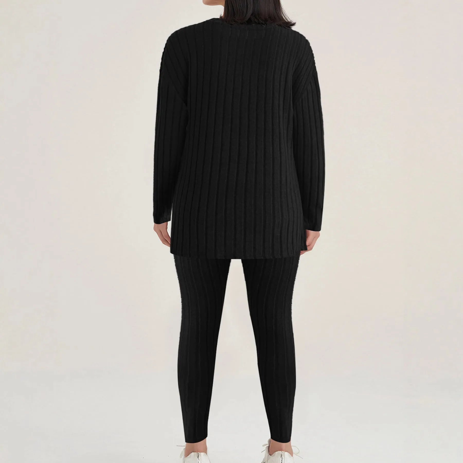 Women's black and blue sunken stripe patterned two-piece polyester homewear set with top and loose-fit pants.