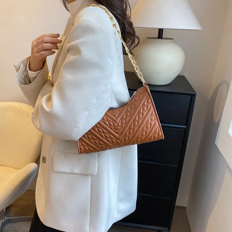Soft PU leather pleated chain baguette shoulder bag in a vertical square shape, shown in brown colour.