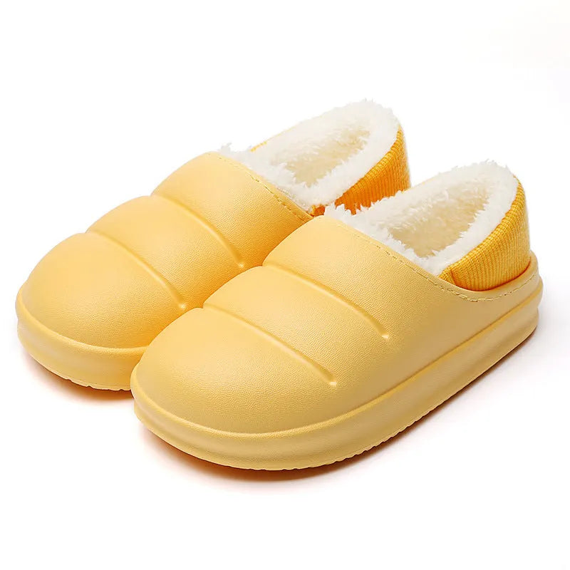 Yellow and green waterproof EVA winter house slippers with plush lining and non-slip sole.
