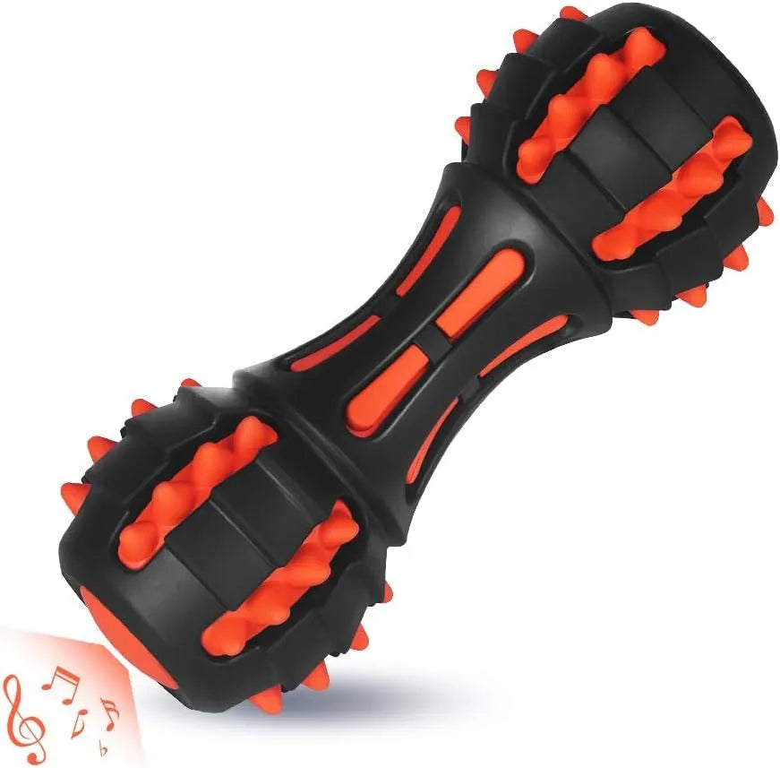 Red dumbbell-shaped dog chew toy with natural rubber construction for aggressive chewers