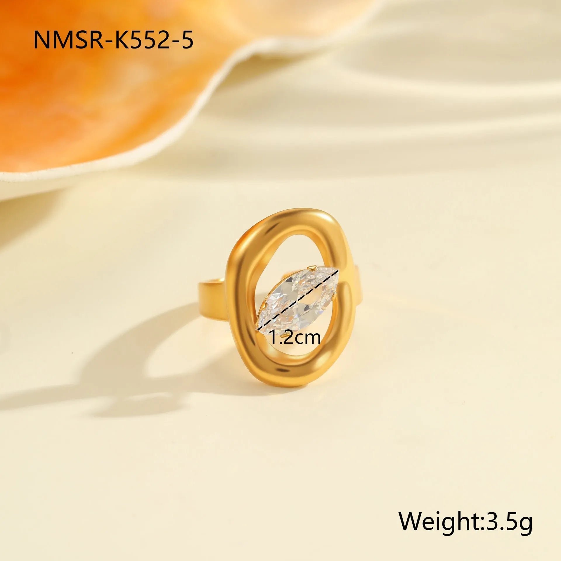 Geometric stainless steel zircon ring with open mouth design on a hand.